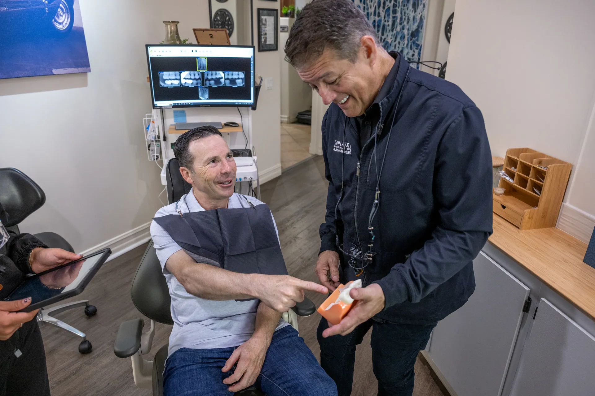 Dr. Hlavaty reviewing a treatment plan with a patient